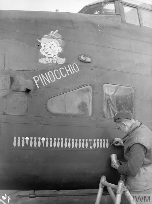 Pinocchio', a veteran Halifax of No 102 Squadron at Pocklington, has the bomb symbol for its 2...jpg