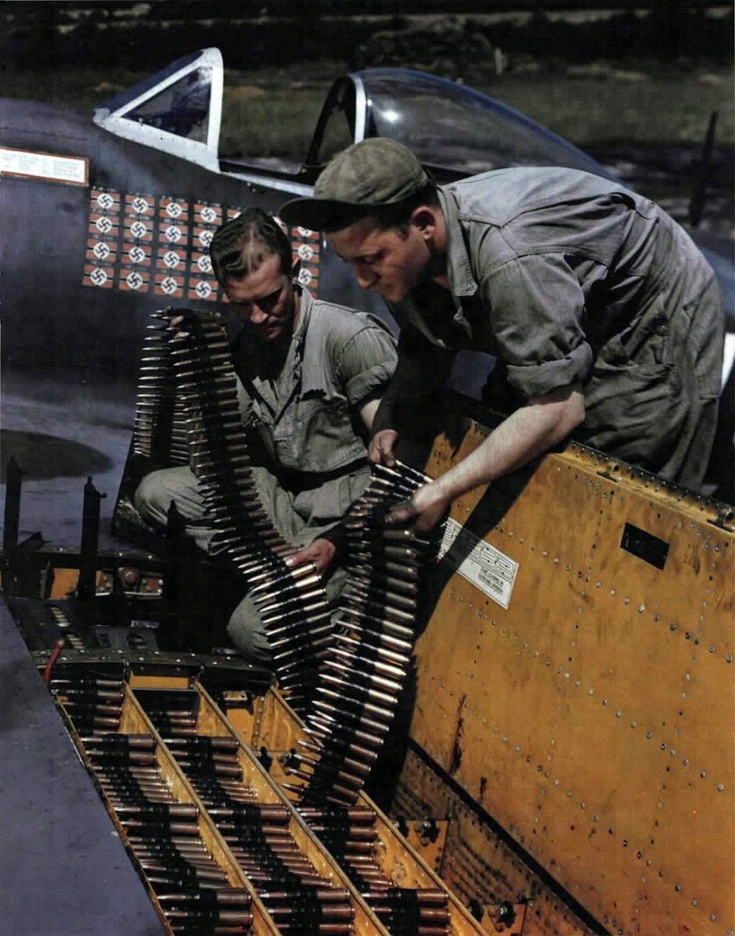 50 ammunition are loaded into the port wing of Lt. Col. Francis S. Gabreski's P-47 by Sgt John...jpg