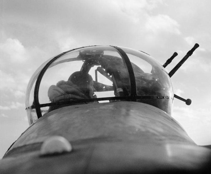 A_No._57_Squadron_Lancaster_mid-upper_gunner_in_his_turret,_February_1943._CH8795.jpg