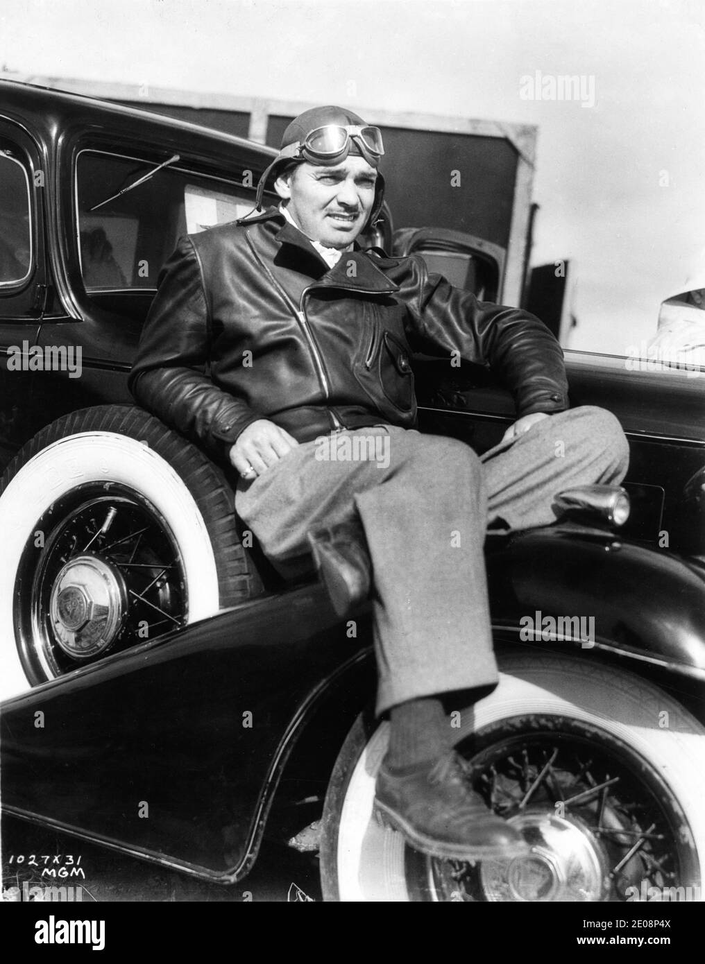 clark-gable-on-set-location-candid-sitting-on-car-during-break-in-filming-of-test-pilot-1938-d...jpg