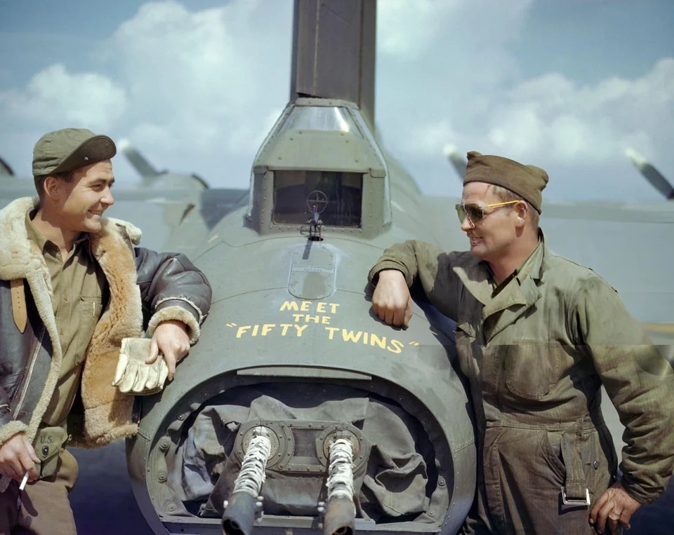 Crew members of a B-17 bomber of the 8th Air Force at the rear defensive installation.jpg