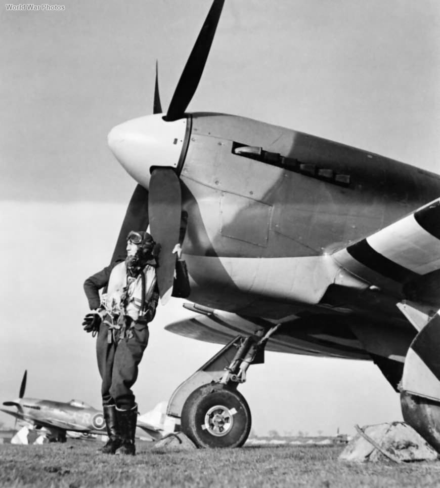 Flight Officer Cullen with Tempest MK V aircraft of No.486 Squadron Royal New Zealand Airforce...jpg