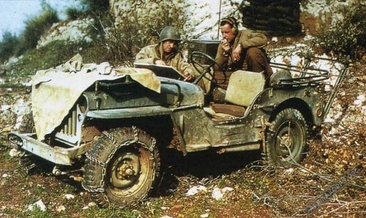 G.I's using a radio in a jeep Italy 1944..jpg