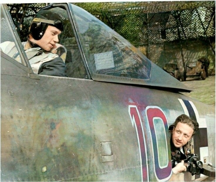 German fighter pilot Wolfgang Rose and a camera man inside his fuselage compartment.jpg