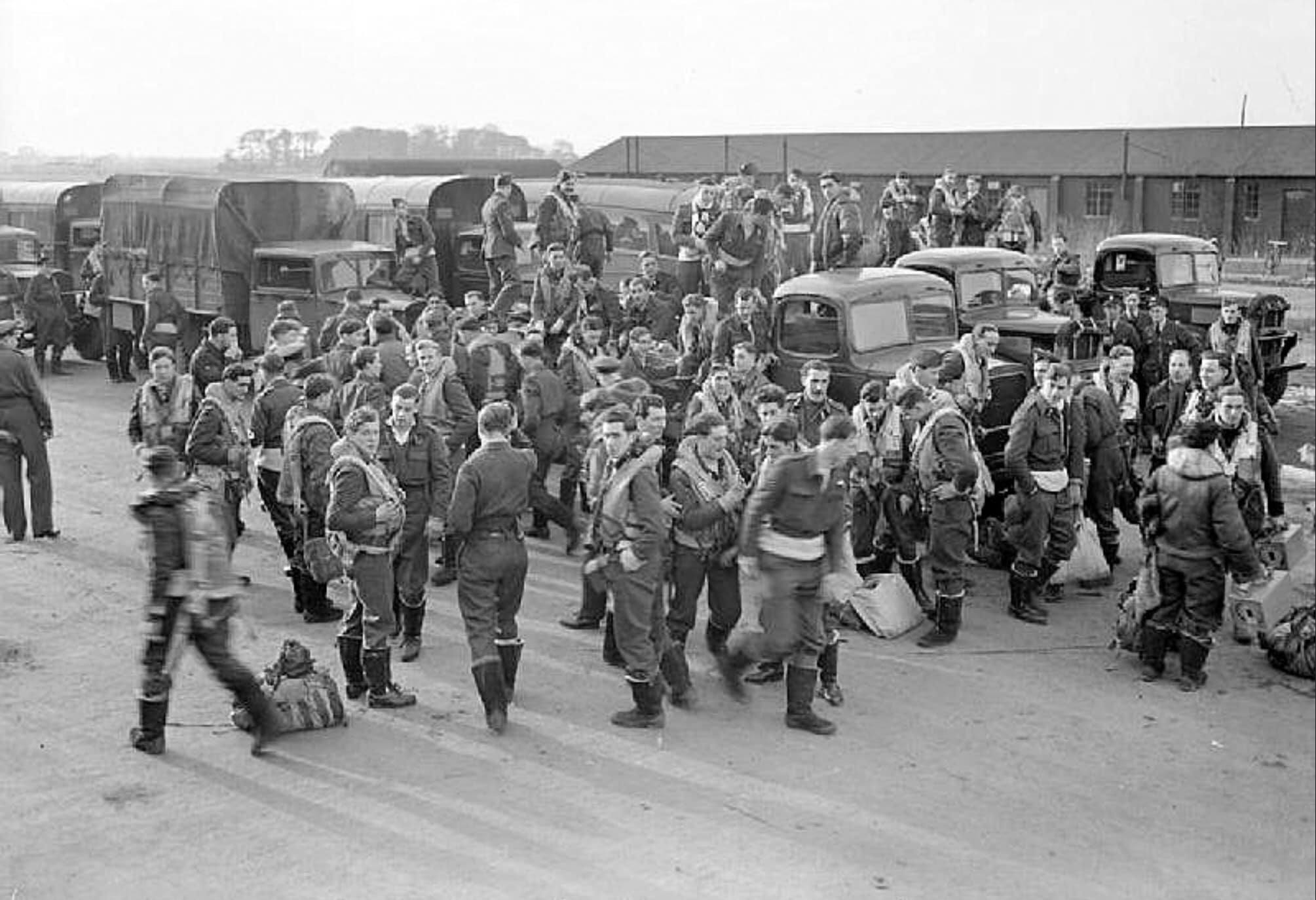Handley Page Halifax crews of No. 76 Squadron RAF board their transports at Holme-on-Spalding-...jpg