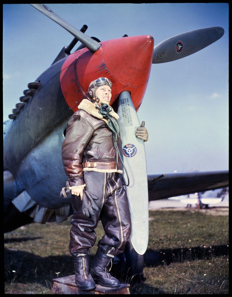 Informal portrait of U.S. Army Air Forces pilot wearing A-6 boots B-3 jacket A-3 trousers B-7 ...jpg