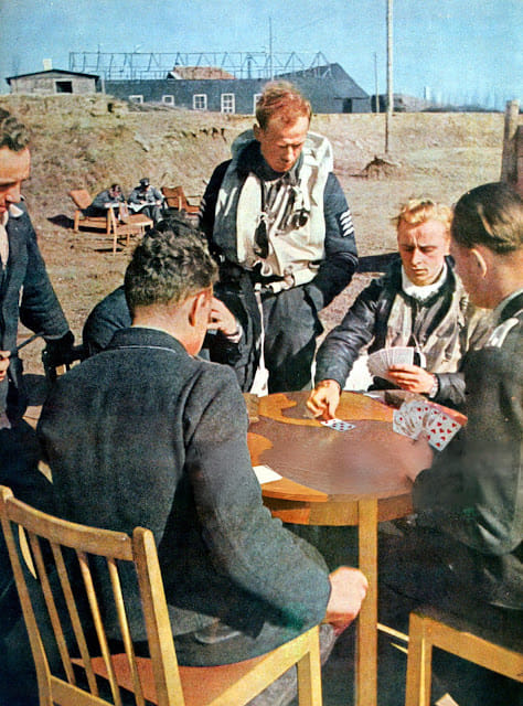Luftwaffe fighter pilots in northern France relaxing and playing cards while awaiting their ne...jpg