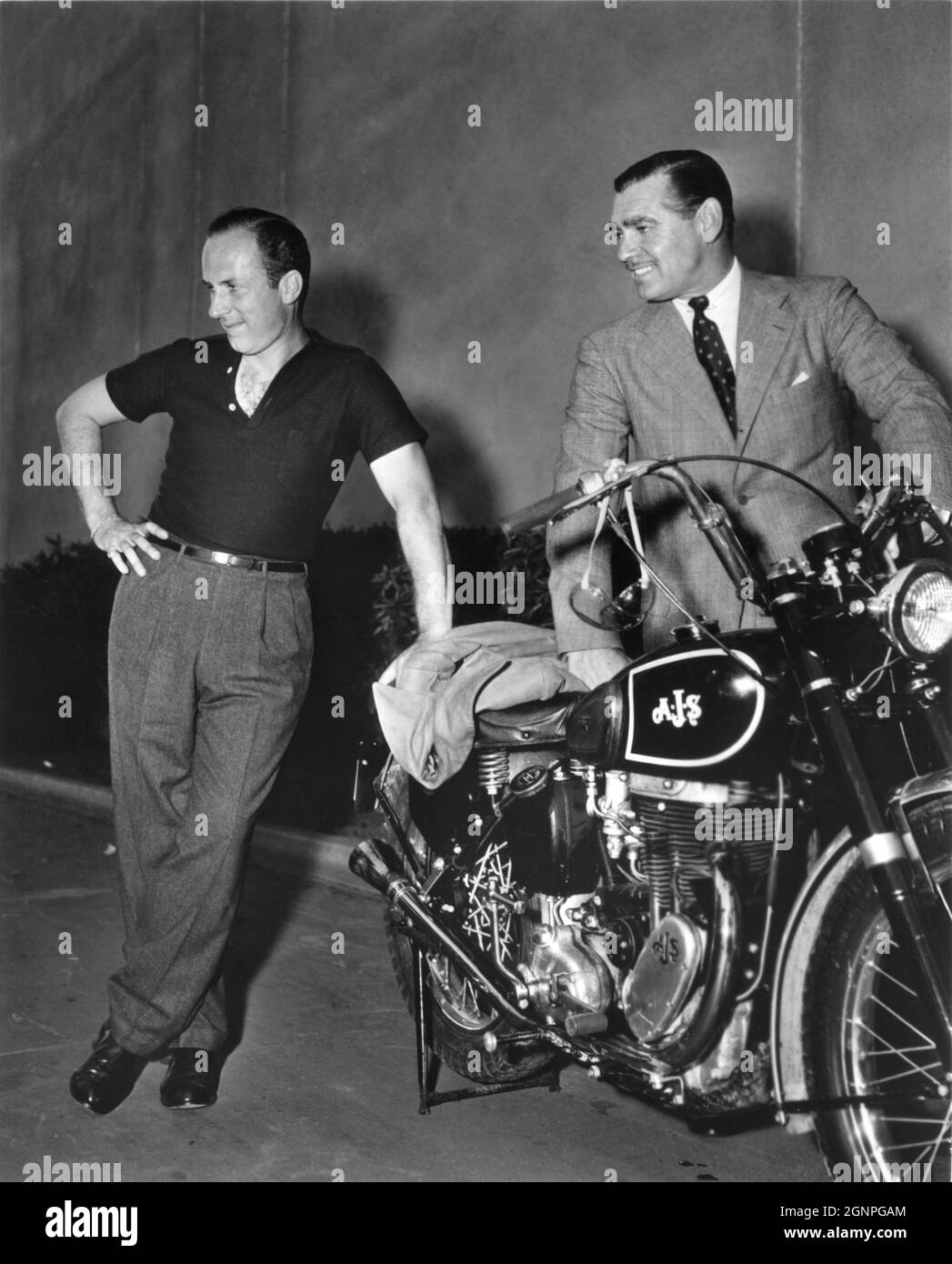 set-visitor-keenan-wynn-and-clark-gable-admire-an-ajs-motorcycle-on-set-candid-during-filming-...jpg